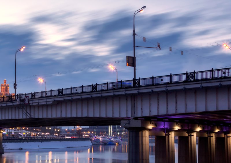 Street lights at dusk over a Beam style bridge 